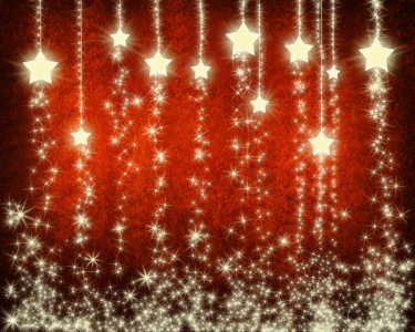 Stelle di Natale luminose su sfondo rosso